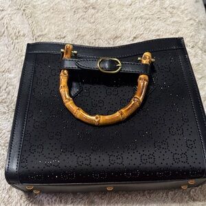 Elegant Black Handbag with Bamboo Handle
